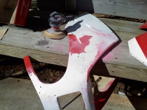 Sanding off the old paint-